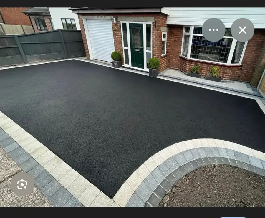 Curved block paved kerb edging alongside a newly finished drive